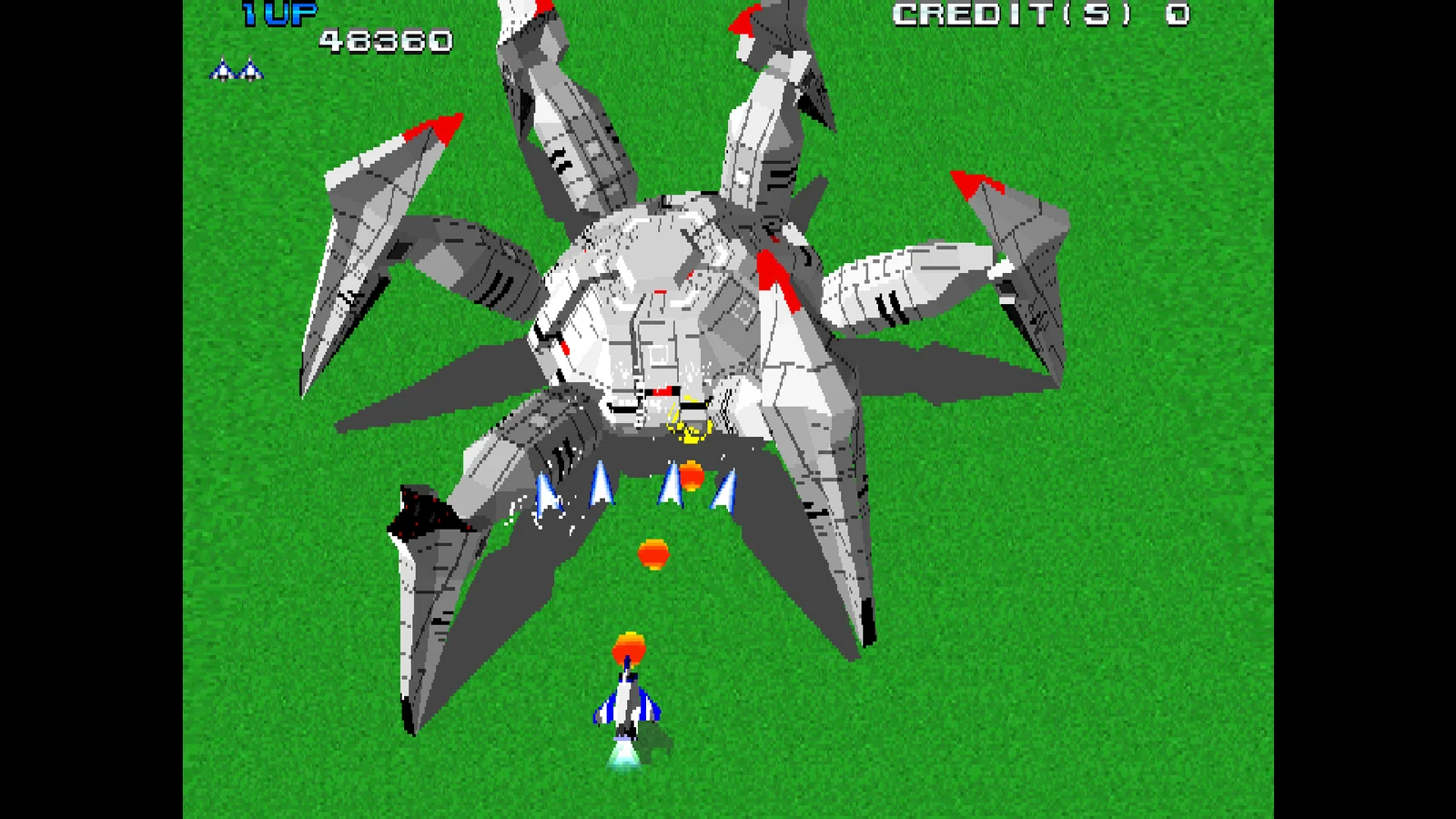 Combate contra un gran enemigo mecánico en Xevious 3D/G