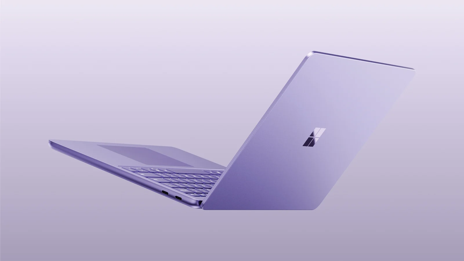 Surface Laptop de 13 pulgadas en color violeta, visto desde atrás y de lado
