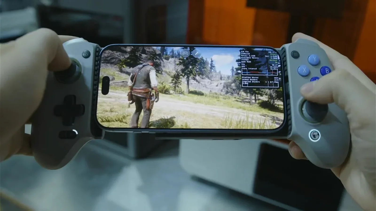 Teléfono con Red Dead Redemption 2 entre dos mandos