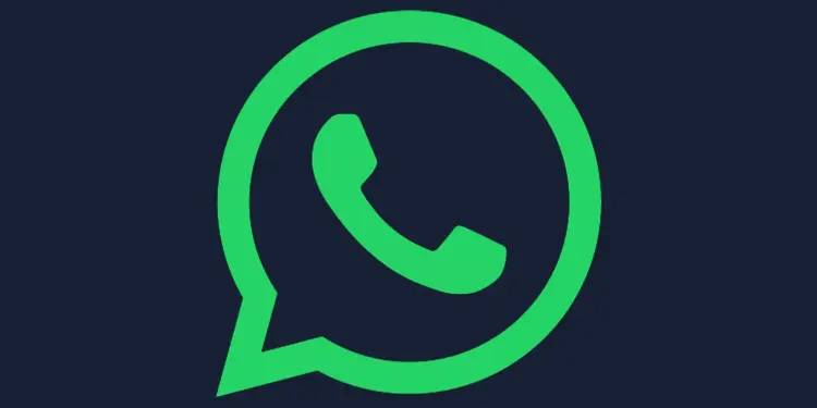 Logotipo verde de WhatsApp sobre fondo oscuro