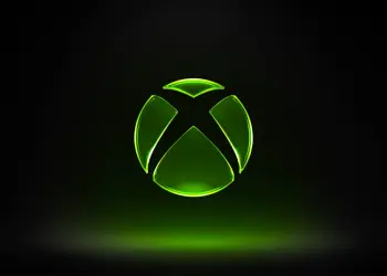 Logotipo luminoso de Xbox sobre fondo oscuro