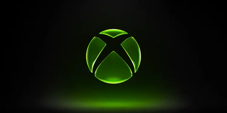 Logotipo luminoso de Xbox sobre fondo oscuro