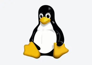 Tux sentado sobre un fondo gris claro