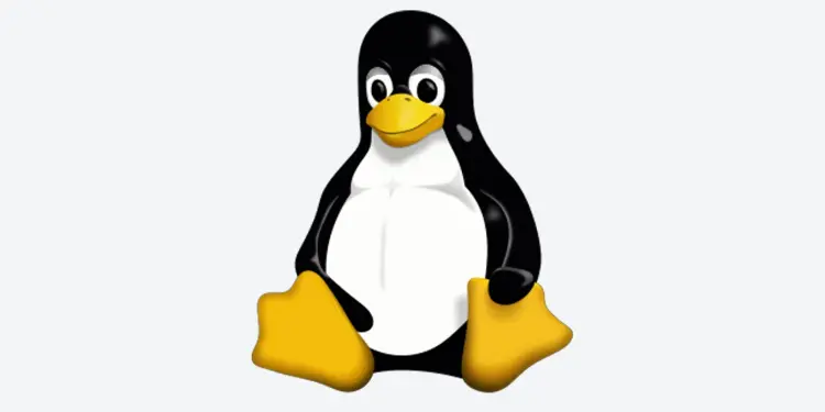 Tux sentado sobre un fondo gris claro