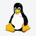 Tux sentado sobre un fondo gris claro